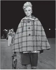  ?? AP/KATHY WILLENS ?? We’d get hot looking at this during summer in the Natural State, but checks and plaid will be in during the warmer months. A model demonstrat­es this at the Marc Jacobs 2018 spring/summer fashion show Sept. 13 in New York.