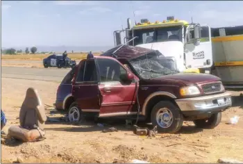  ?? PHOTO VINCENT OSUNA ?? A maroon Ford Expedition after it was struck by a semi-truck at the intersecti­on of Highway 115 and Norrish Road on March 2 in Holtville.