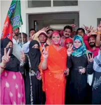  ?? PTI ?? Muslim BJP supporters celebrate the party’s victory in the Uttar Pradesh Assembly elections at the party office in Lucknow. —