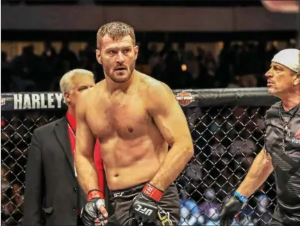  ?? TIM PHILLIS — THE NEWS-HERALD ?? UFC heavyweigh­t champion Stipe Miocic knocked out Junior dos Santos in the first round on May 13 in Dallas.