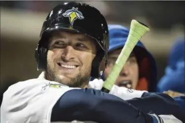  ?? SEAN RAYFORD — ASSOCIATED PRESS ?? Columbia Fireflies outfielder Tim Tebow smiles during a game against the Augusta GreenJacke­ts in Columbia, S.C., in April.