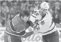  ?? RICHARD WOLOWICZ/GETTY IMAGES ?? Ottawa native Mark Fraser, tangling with Montreal’s Brandon Prust, is the only Toronto Maple Leafs player who can taunt in both languages.