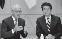  ?? AFP PHOTO ?? SECURITY MEET
Australia’s Prime Minister Malcolm Turnbull (L front) speaks with his Japanese counterpar­t Shinzo Abe (R) during a meeting of Japan’s National Security Council at Abe’s official residence in Tokyo on Thursday.