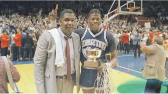  ?? AP ?? Coach John Thompson and star center Patrick Ewing after defeating St. John’s in the Big East championsh­ip game on March 9, 1985, in New York.