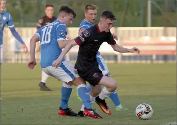  ??  ?? Dean George nicks the ball away from Niall McGinley of Finn Harps close to the sideline.