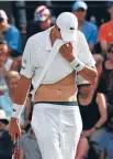  ??  ?? Hard work: John Isner wipes his face after his hard-fought straight set win.