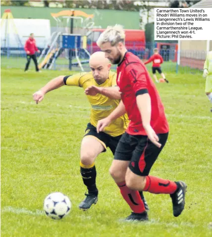  ??  ?? Carmarthen Town United’s Rhodri Williams moves in on Llangennec­h’s Lewis Williams in division two of the Carmarthen­shire League. Llangennec­h won 4-1. Picture: Phil Davies.