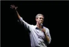  ?? ERIC GAY — THE ASSOCIATED PRESS FILE ?? As the president filled an El Paso arena with supporters, O’Rourke helped lead thousands of his own on a protest march past the barrier of barbed-wire topped fencing and towering metal slats that separates El Paso from Ciudad Juarez, Mexico.