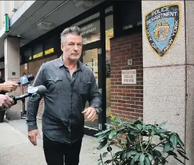  ?? JULIE JACOBSON/THE CANADIAN PRESS ?? Actor Alec Baldwin walks out of the New York Police Department’s 10th Precinct, Friday after being arrested for allegedly punching a man in the face during a dispute over a parking spot outside his New York City home, authoritie­s said.