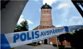  ?? AP ?? A police cordon is set up near the scene of a robbery at the Strangnas Cathedral, in Strangnas, Sweden.