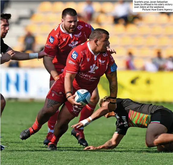  ?? Picture: Huw Evans Agency ?? Scarlets prop Javan Sebastian looks to offload in his side’s victory over Zebre at the weekend.