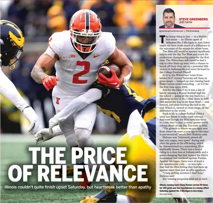  ?? PAUL SANCYA/AP ?? Illinois running back Chase Brown carried 29 times for 140 yards and two touchdowns in a losing effort Saturday against No. 3 Michigan in Ann Arbor.