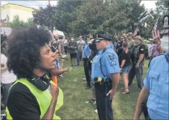  ?? MEDIANEWS GROUP FILE PHOTO ?? Ridley Township police keep Black Lives Matter marchers and counter-protesters apart at a tense confrontat­ion on Saturday.