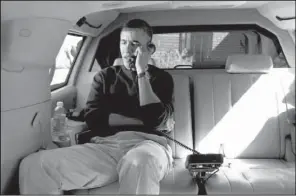  ?? AP/PETE SOUZA ?? President Barack Obama talks with Afghanista­n President Hamid Karzai from his vehicle outside the Jane E. Lawton Community Center in Chevy Chase, Md., on Sunday.