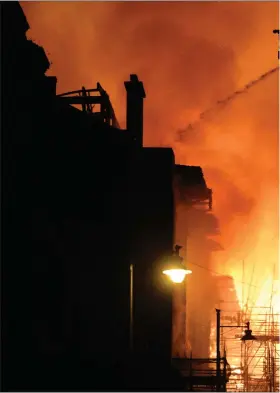  ??  ?? Firefighte­rs tackle the huge blaze which broke out and ripped through the Charles Rennie Mackintosh building