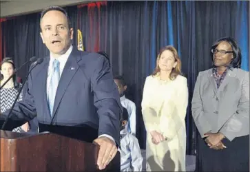  ?? Timothy D. Easley
Associated Press ?? MATT BEVIN, the governor-elect of Kentucky — shown with his wife, Glenna, center, and Lt. Gov.-elect Jenean Hampton, also a Republican — brings the count of Southern Republican governors to all but two now.
