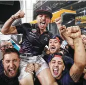  ?? Lars Baron / Getty Images ?? Max Verstappen celebrates with his team after winning the Grand Prix of Abu Dhabi on Sunday.