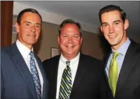  ??  ?? Steve Gillin, center, gets a moment with Wes Lang of Palm Beach and Chris Smith of Colorado, grandson of the organizati­on’s founder.