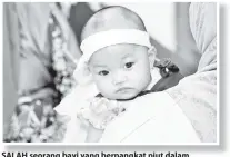  ??  ?? SALAH seorang bayi yang berpangkat piut dalam keluarga ini. ANTARA lima generasi Keluarga Tarbu Sulai dan Talib Pakir yang sempat dirakamkan sebelum sukaneka dimulakan.