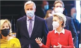  ?? -AP ?? EU Commission President Ursula von der Leyen, right, and Head of the Task Force for Relations with the UK Michel Barnier, second left, arrive for a debate on the EU-UK trade and cooperatio­n agreement at the EU Parl in Brussels.