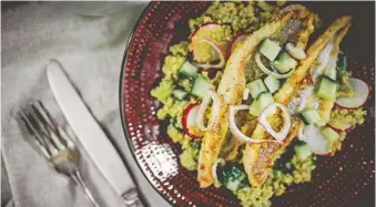  ??  ?? Blackened Catfish with Quinoa and Citrus Vinaigrett­e.