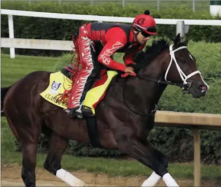  ?? GARRY JONES — THE ASSOCIATED PRESS ?? Exercise rider Martin Rivera gallops Kentucky Derby hopeful Classic Empire at Churchill Downs in Louisville, Ky., Wednesday.