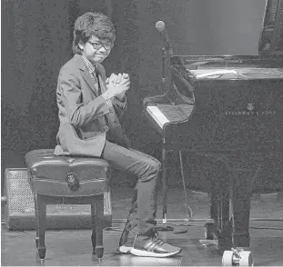  ?? Dave Rossman / For the Chronicle ?? Jazz prodigy Joey Alexander, 13, thanks the crowd Friday night at the Wortham.