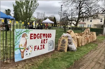  ??  ?? Saturday’s Edgewood Cemetery Art Fair and Cleanup netted about $2,400to kick off the spring maintenanc­e season, not to mention the many bags of yard waste for composting.
