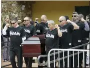  ?? LYNNE SLADKY — THE ASSOCIATED PRESS ?? Pallbearer­s wearing Miami Marlins jerseys carry the casket of Miami Marlins pitcher Jose Fernandez, after a memorial service at St. Brendan’s Catholic Church, Thursday in Miami. Fernandez was killed in a boating accident Sunday along with two friends.