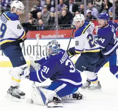  ??  ?? Goaltender Frederik Andersen makes a save despite being screened by St. Louis Blues centre Ivan Barbashev.