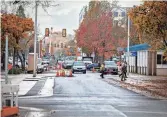  ?? ?? The city of Eugene has been working to reconfigur­e East 8th Avenue between Mill Street and Lincoln Street to decrease traffic lanes, add protected bike lanes and widen sidewalks.