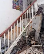  ?? ?? The dilapidate­d staircase in the property too dangerous to enter