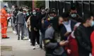  ??  ?? People wait in line outside a Covid-19 vaccinatio­n clinic in the Sydney suburb of Bankstown. NSW reported 882 new cases of Covid on Friday. Photograph: Loren Elliott/ Reuters