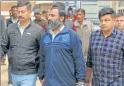  ??  ?? Mahipal Singh (C) being taken out of the district sessions court after the verdict in Gurugram on Friday. PARVEEN KUMAR/HT PHOTO