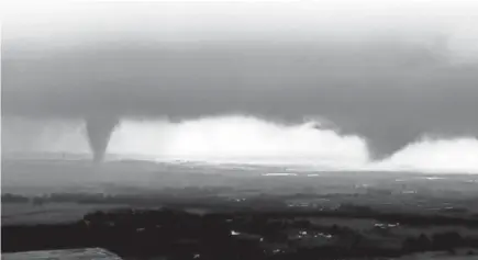  ?? AP ?? This image made from video provided by KWTV-KOTV shows two funnel clouds Monday near Crescent, Oklahoma.