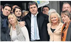  ??  ?? Sir Norman Bettison speaks to the media outside Preston Crown Court yesterday, right. Above, victims’ families and some of their supporters outside the High Court in 2012