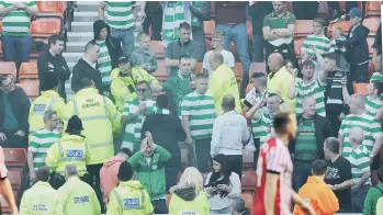  ??  ?? Stewards among the Celtic fans at the game