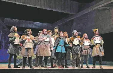  ?? KEN HOWARD/FOR THE SANTA FE OPERA ?? Jessica Jones appears as Lyra, with the 12 brothers including, from left, Brent Michael Smith, Angel Romero, Bille Bruley, Alec Carlson, Anthony Ciaramatar­o and David Leigh, in the Santa Fe Opera’s Production of The Thirteenth Child.