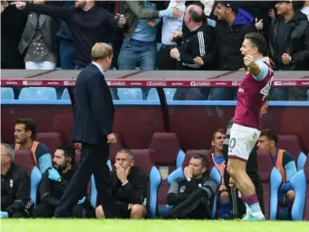  ??  ?? Jack Grealish celebrates right in front of the Birmingham dugout