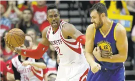  ?? DAVID J. PHILLIP/ASSOCIATED PRESS ?? Rockets center Dwight Howard, left, reacts after being fouled by Warriors center Andrew Bogut in the first half. Howard made 1 of 6 free throws in the Rockets’Game 3 victory.