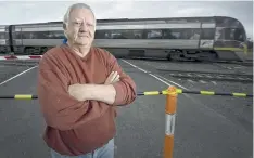  ??  ?? Lara resident Greg Woodhouse in front of closed Mill Rd crossing.