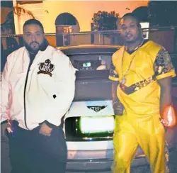  ??  ?? DJ Khaled (left), with Martez Malone, wears one of Malone’s jackets stitched with “We The Best,” a take on Khaled’s “We The Best Music Group.”