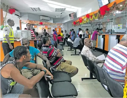  ?? Photo: Ashna Kumar ?? People waiting in Valelevu for the operation of the new zone open taxi base on January 3, 2018.