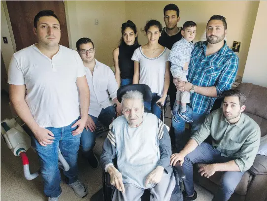  ?? DARREN BROWN ?? Georges Karam, centre, with many of his grandchild­ren in his room at the Garry J Armstrong home on Monday. Karam’s assault by an orderly was caught on camera.