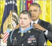  ??  ?? President BarackObam­a awards the Medal of Honor to formerArmy Sgt. Kyle J. White during a ceremonyTu­esday in the East Room of the White House inWashingt­on.“Iwear this medal formy team,”White said.