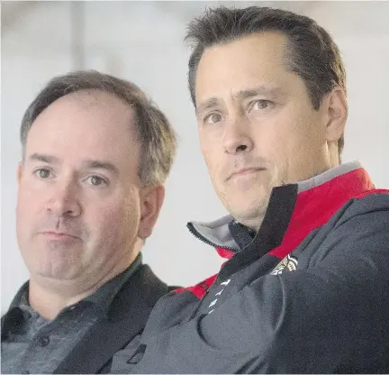  ?? ADRIAN WYLD/THE CANADIAN PRESS ?? Senators GM Pierre Dorion, left, and coach Guy Boucher have some decisions to make with veterans injured.