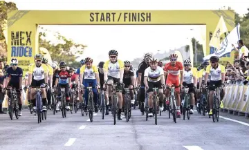  ?? — Bernama photo ?? Raja Muda Selangor Tengku Amir Shah (front, centre) and Syed Saddiq on his right charge on after the flag-off of the MEX 2018 cycling event at Seri Kembangan. Also seen is national cycling champion Azizulhasn­i Awang (front, fourth right).