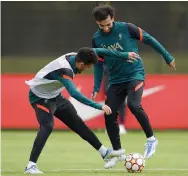  ?? — AP ?? Liverpool’s Luis Diaz (left) and Mohamed Salah at a training session ahead of their Champions League final in Liverpool, England, on Wednesday.