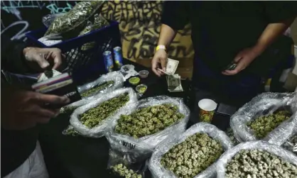  ??  ?? ‘In November’s US presidenti­al contest, voters from across the political spectrum chose to legalise recreation­al cannabis.’ A cannabis market in Los Angeles, California. Photograph: Richard Vogel/AP