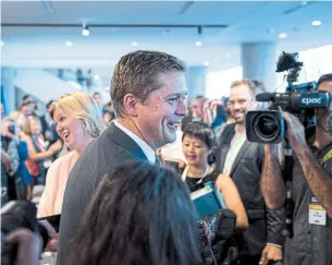  ?? DARREN CALABRESE THE CANADIAN PRESS ?? Conservati­ve Leader Andrew Scheer greets supporters at the party’s convention in Halifax.